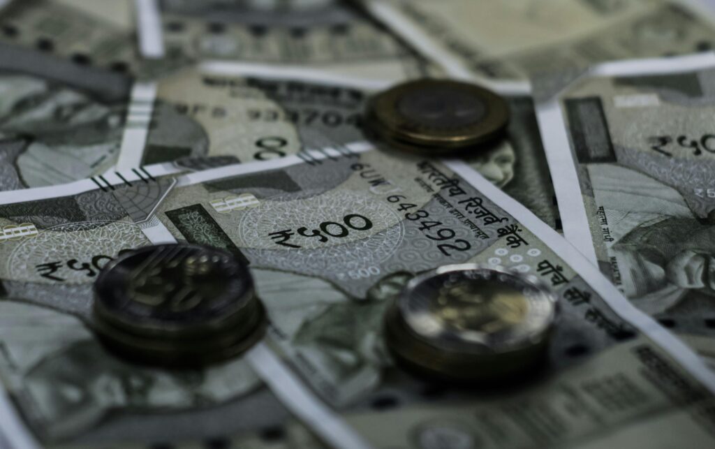 Detailed view of Indian currency notes and coins representing wealth and finance.